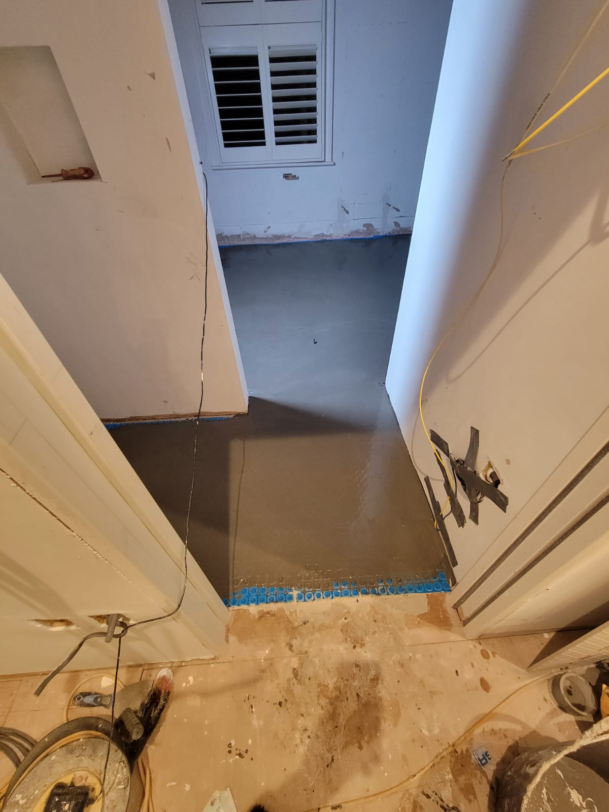 New electric underfloor heating, wall and floor tiling in Clapham, before